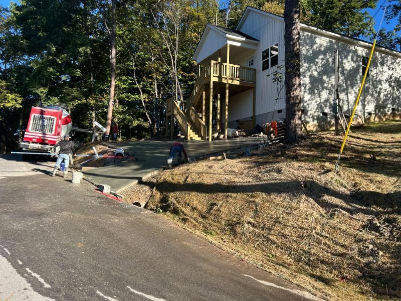 Crew pouring the concrete driveway in front of the new home
